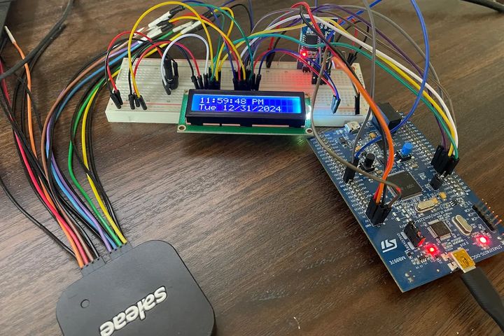 STM board connected to breadboard with RTC and LCD display
